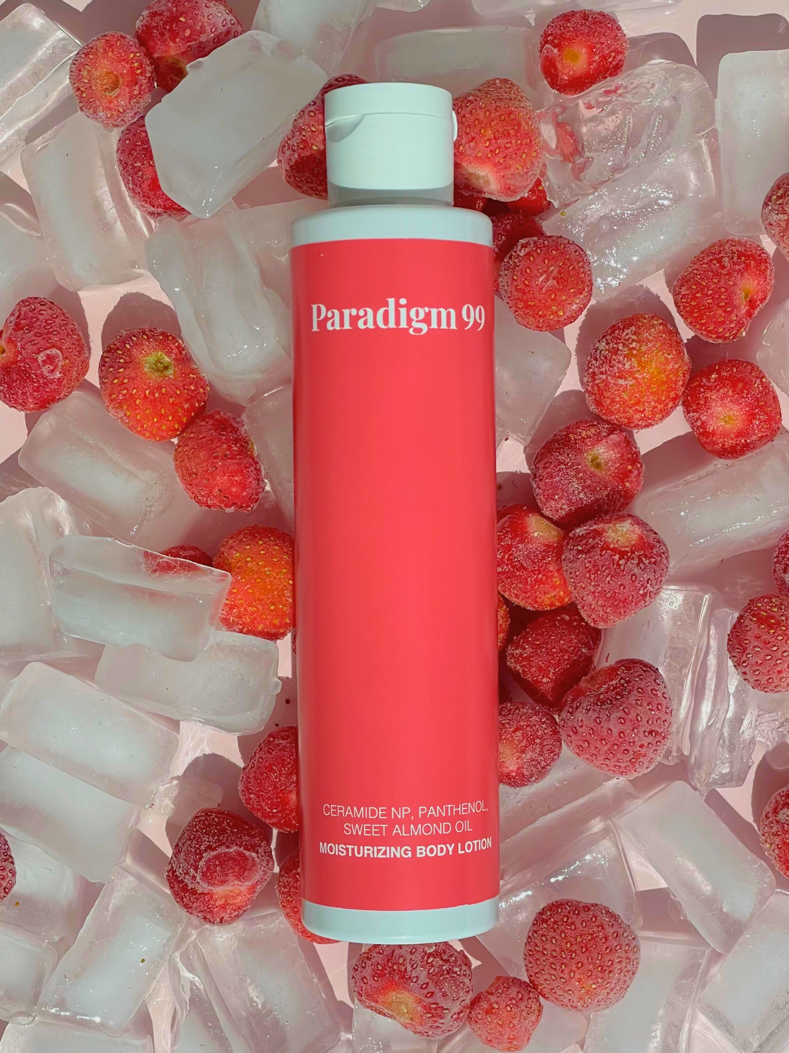 Red bottle labeled 'Paradigm 99' moisturizing body lotion surrounded by strawberries and ice cubes.