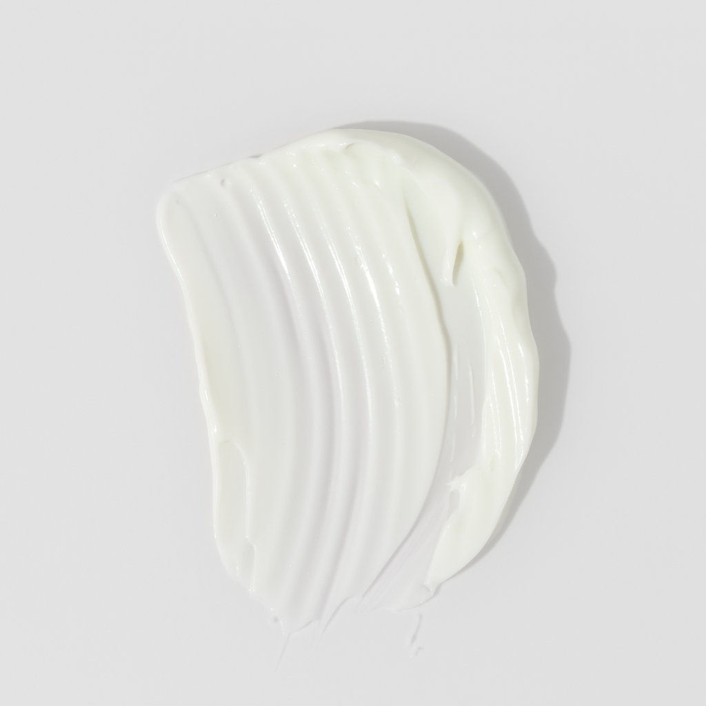 White cream swatch on a light gray background.