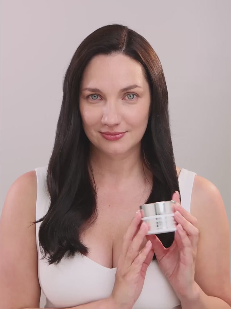 Woman applying Paradigm 99 Super Glow hydrating face cream with vitamin C and hyaluronic acid